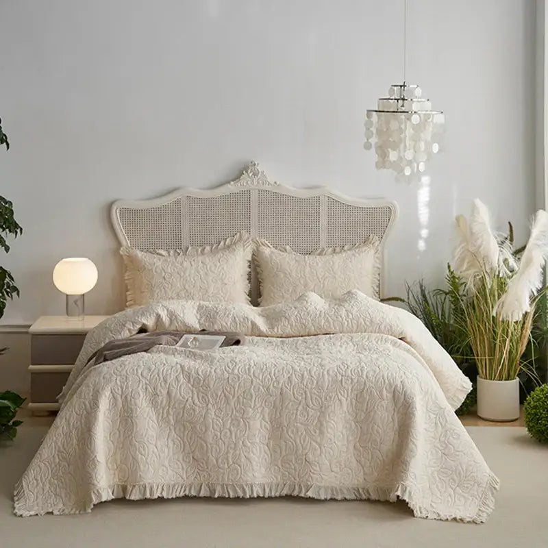 Cream-colored decorbites cotton quilted bedspread set with delicate floral pattern and fringed edges for bedroom decor