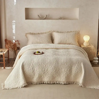 Cream-colored decorbites cotton quilted bedspread set with textured leaf pattern and fringed edges for bedroom decor
