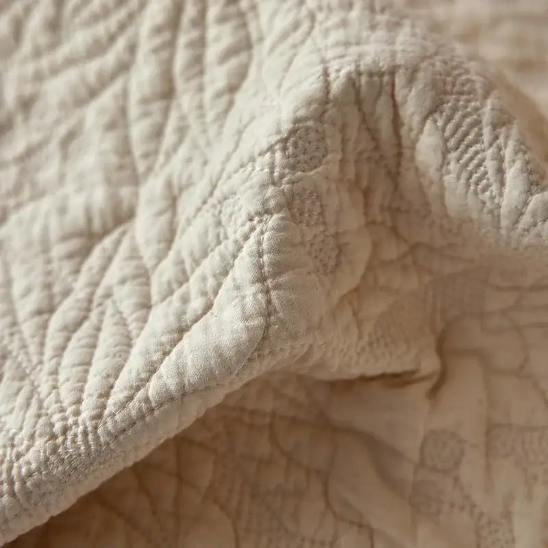 Cream cotton quilted bedspread set with textured surface and subtle pattern featuring fringes for bedroom decorbites cotton quilted