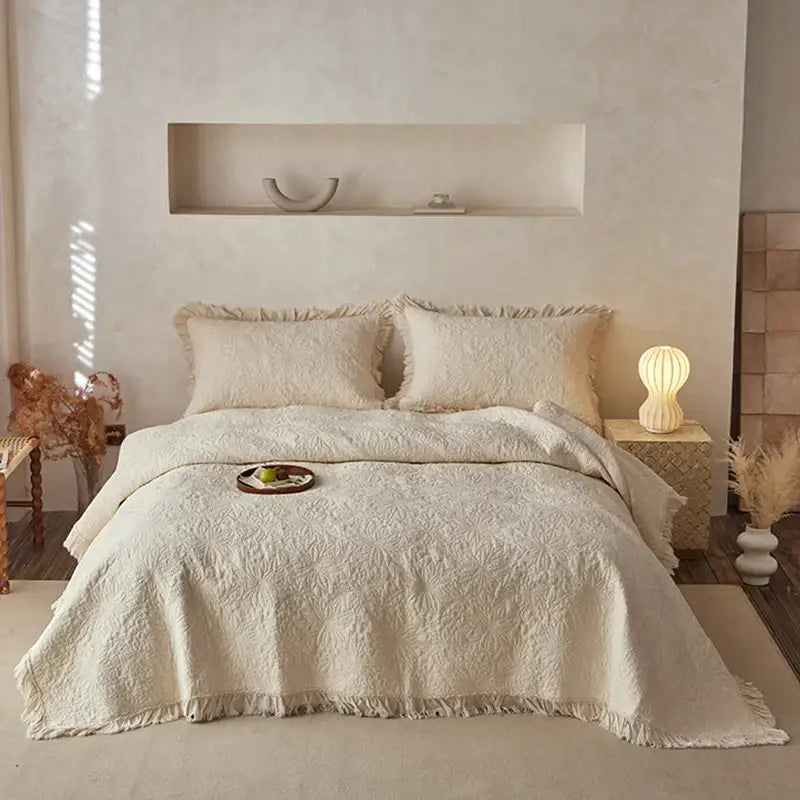 Cream-colored decorbites cotton quilted bedspread set with textured pattern and fringed edges for bedroom decor