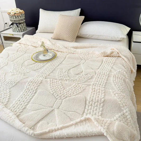 Cream-colored plush jacquard sofa cover blanket with textured raised floral and geometric patterns for living room use