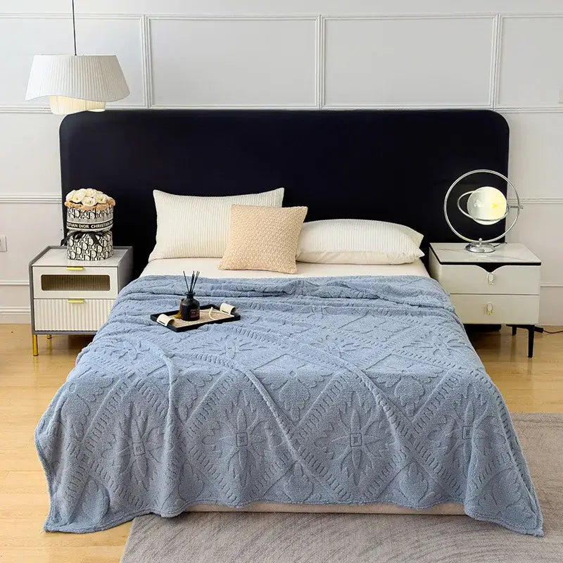Light blue plush jacquard sofa cover blanket with textured diamond and floral pattern for living room use