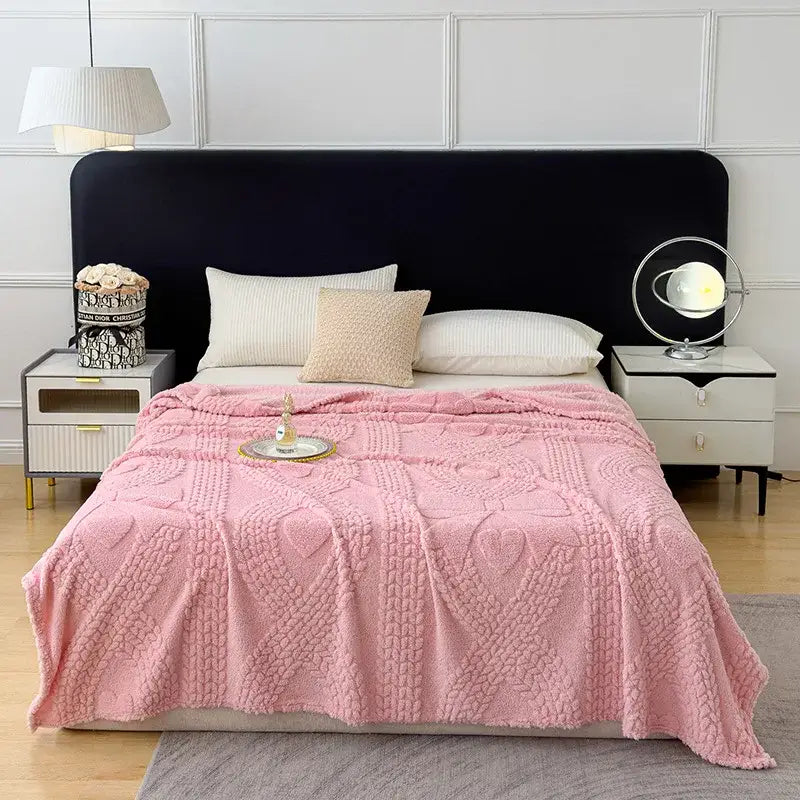 Pink textured throw blanket with plush feel and intricate knit patterns as a cozy sofa cover blanket for living room