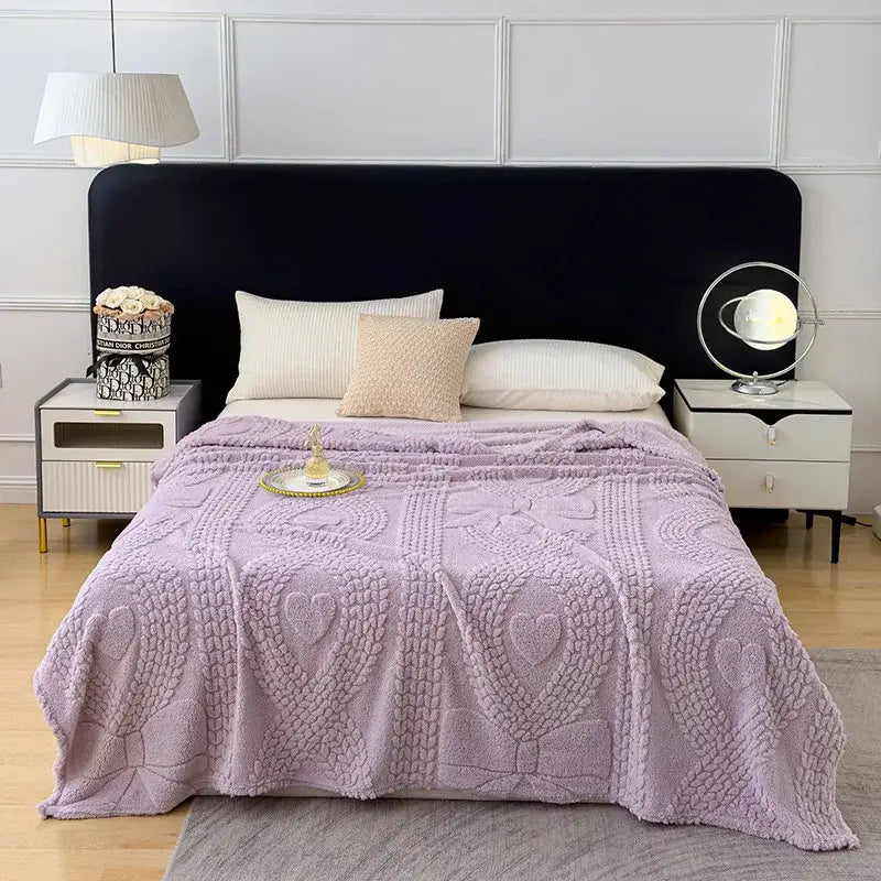 Soft lavender knitted sofa cover blanket with textured heart motifs and cable designs for living room use