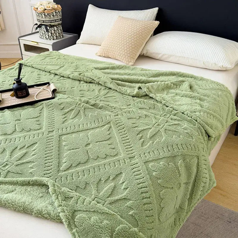 Soft mint-green textured jacquard sofa cover blanket with raised floral and geometric patterns for living room use