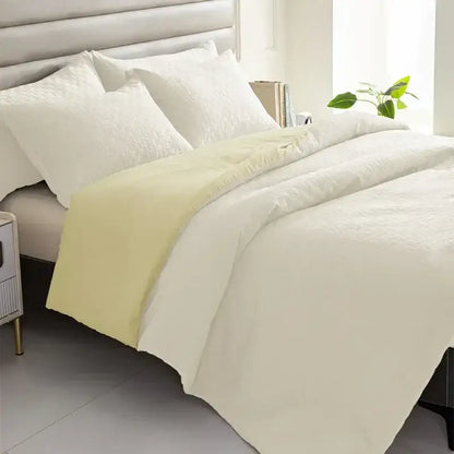 Cream-colored quilt set with soft textured weave and subtle pale yellow accent panel for decorbites comforter bedding