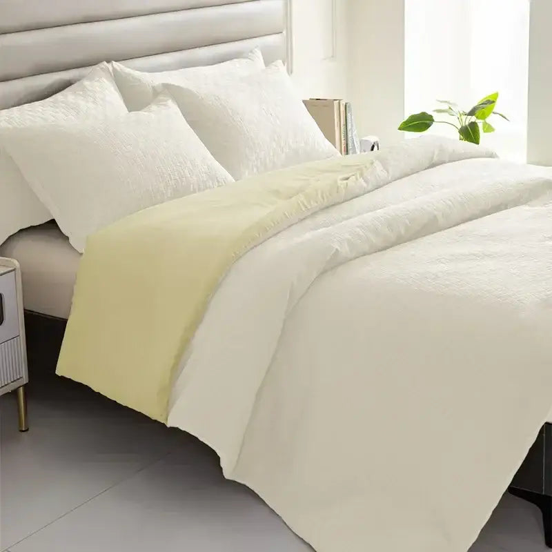 Cream-colored quilt set with soft textured weave and subtle pale yellow accent panel for decorbites comforter bedding