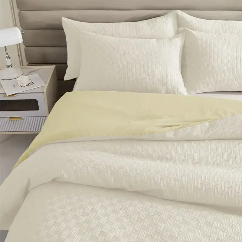 Cream-colored quilt set with subtle woven texture and matching pillowcase quilt set from DecorBites comforter collection