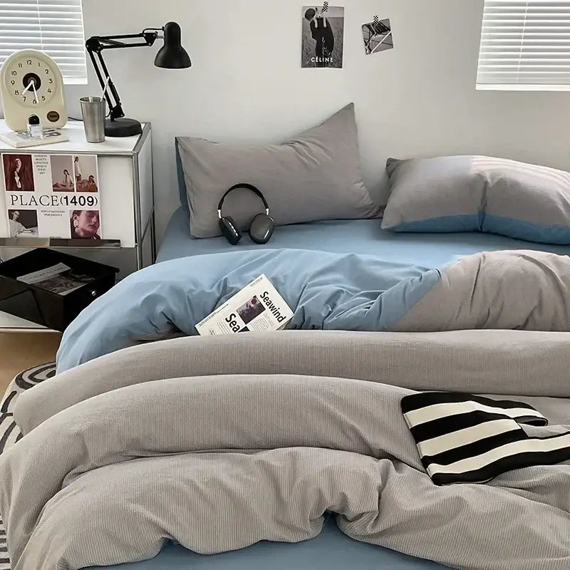 Gray corduroy duvet cover with black and white striped throw on dark gray bubble cotton quilt set for bedroom