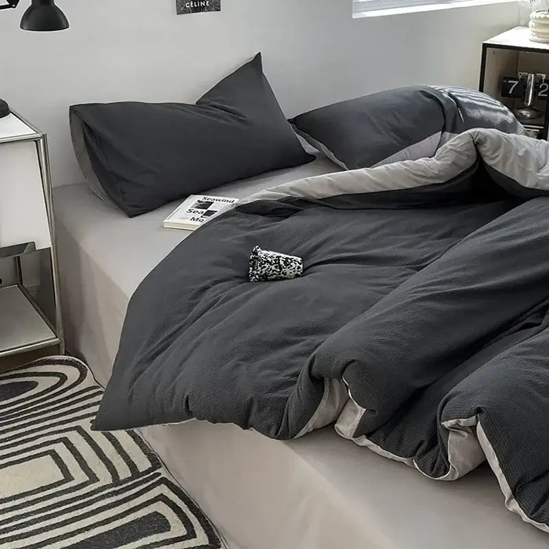 Dark gray textured bubble cotton quilt set with subtle ribbed pattern and light gray inner lining for bedroom use