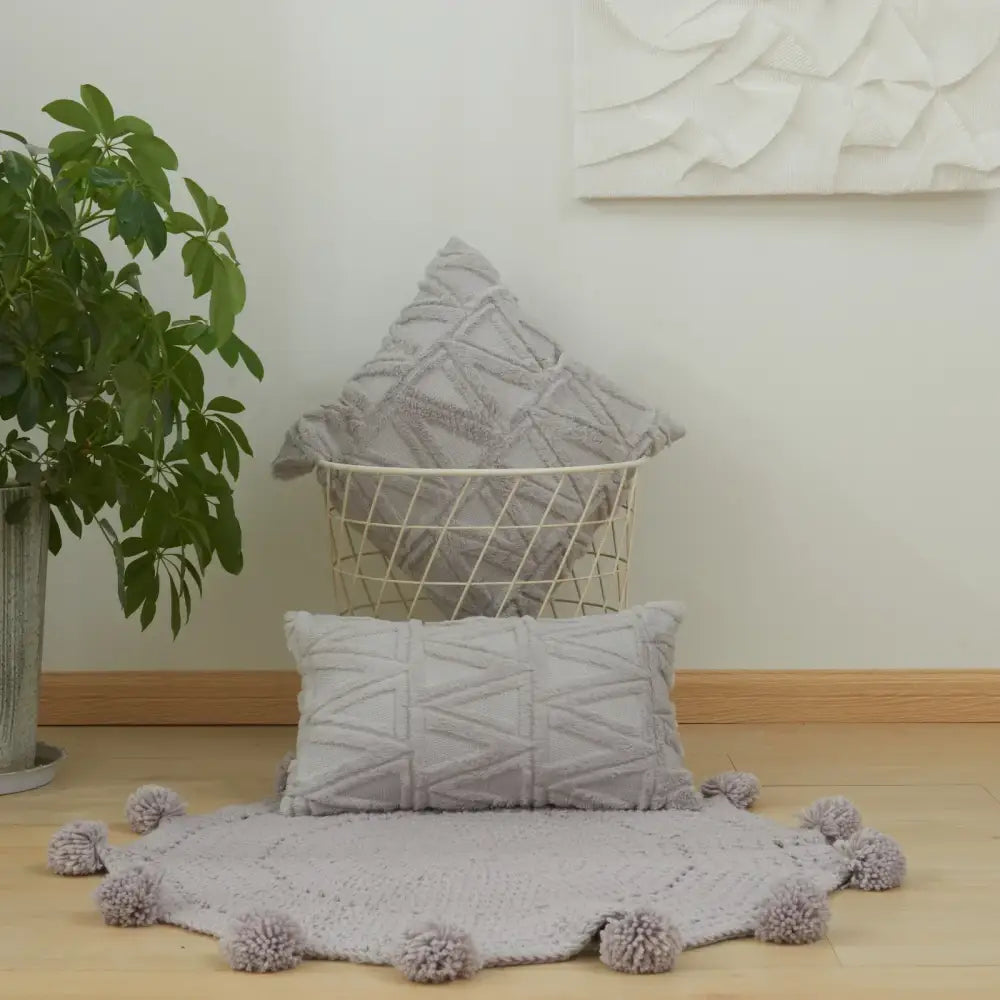 Gray textured throw pillow with geometric diamond embroidery living room cushion cover and pom-pom trim