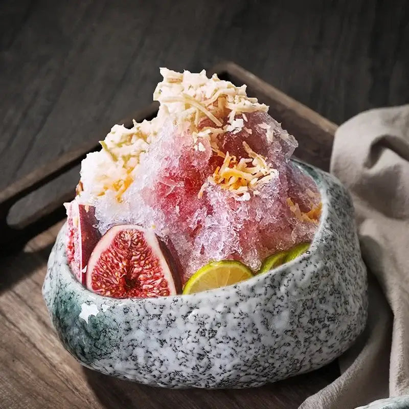 A speckled gray decorbites ceramic dessert bowl filled with dessert sashimi ice and fresh fig slices for dining room use