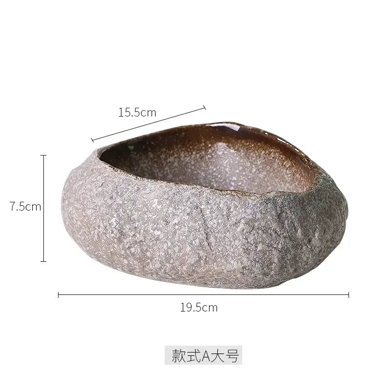 A rustic handcrafted decorbites ceramic dessert planter with textured gray exterior and glossy brown interior for dining room