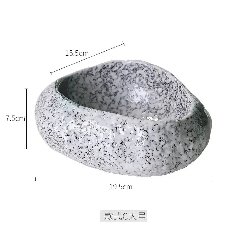 A white ceramic dessert bowl with speckled gray texture and irregular shape for decorbites ceramic dessert use