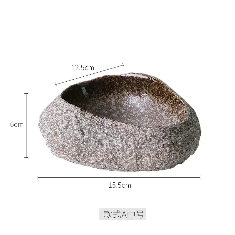 A rustic decorbites ceramic dessert plate with speckled gray brown glaze and organic irregular shape for dessert sashimi ice