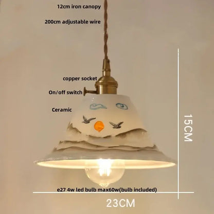 A ceramic pendant light with hand-painted face design and soft white glaze for decorbites clear glass led lighting