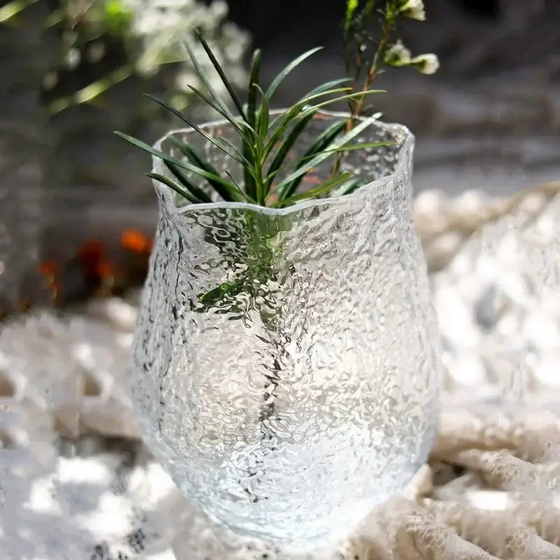 Clear textured frosted green transparent glass vase with wavy rim holding greenery for living room decorbites decor