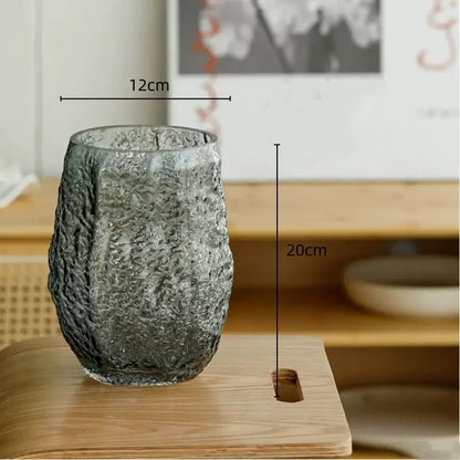 Textured frosted green transparent glass vase with rough organic surface and flared rim for living room decorbites decor