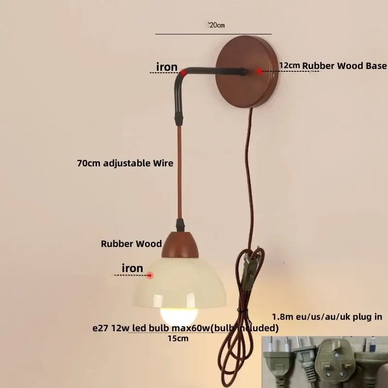 Rustic wall light fixture with warm rubber wood base, iron arm, and frosted glass shade for dining room use