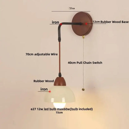 A warm-toned rustic iron and rubber wood wall light fixture with textured glass shade for dining room use