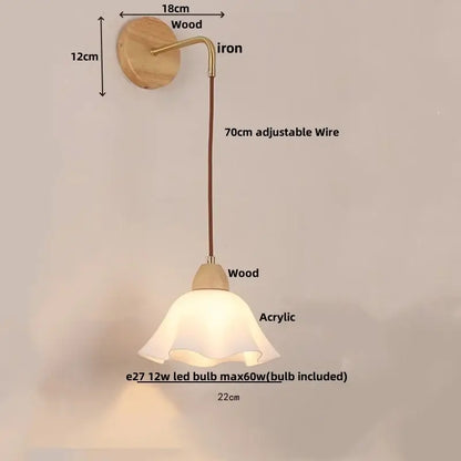 A warm-toned decorbites adjustable led wall light with wooden base and acrylic shade for bedroom sconce decor