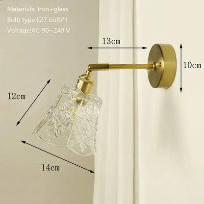 Brass-finished wall sconce with clear etched floral glass shade featuring decorbites brass mirror for bedroom decor