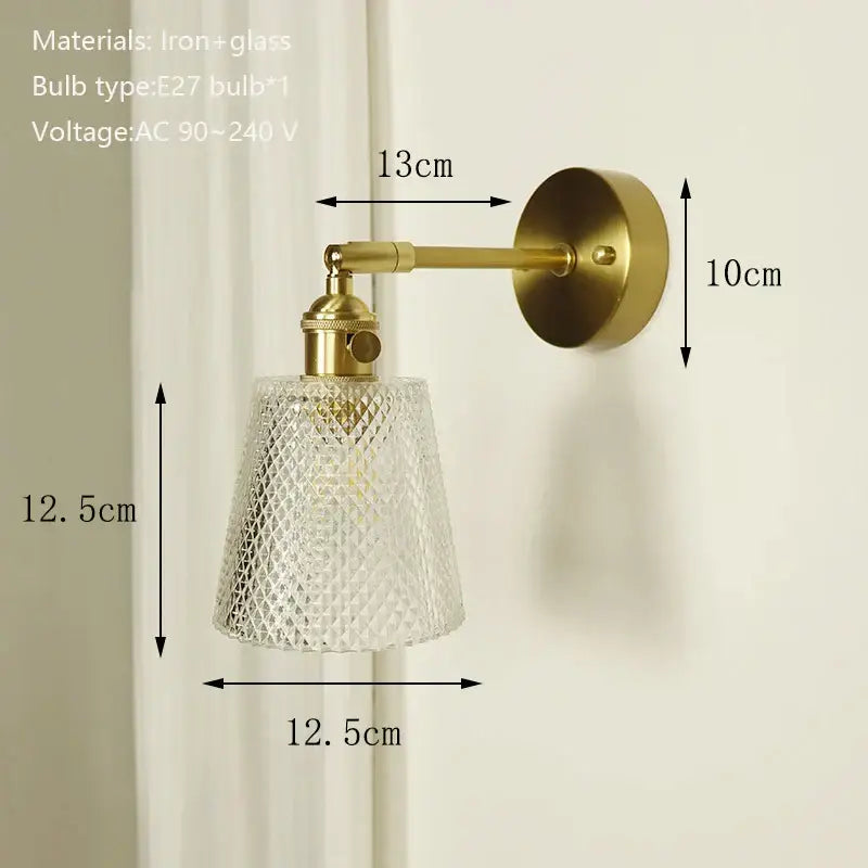 Vintage-style brass mirror wall sconce with textured clear glass shade ideal for bedroom decor by decorbites brass mirror