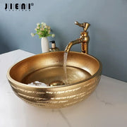Textured golden ceramic bathroom basin set featuring a gold-finished ridged vessel sink by decorbites golden ceramic