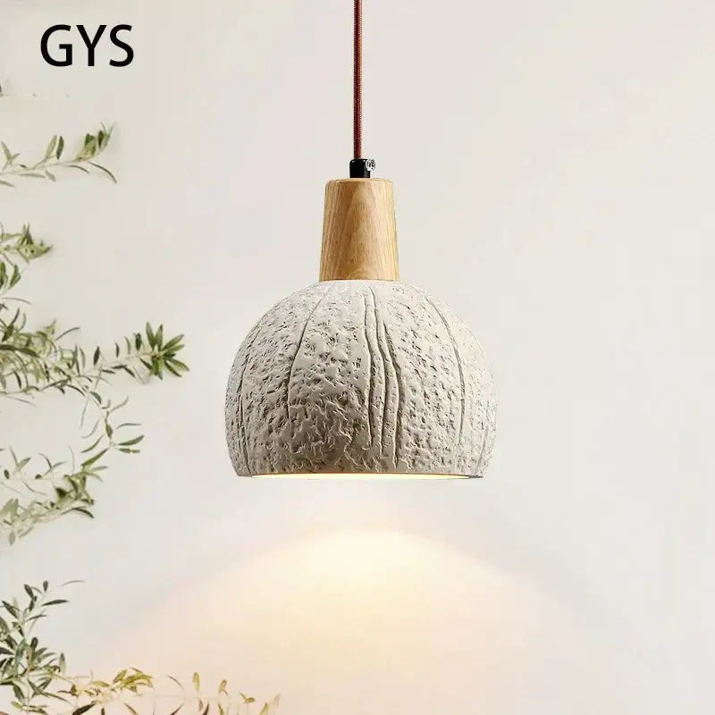 Textured gray cement pendant lamp with natural wood top and brown cord for dining room decorbites cement chandelier