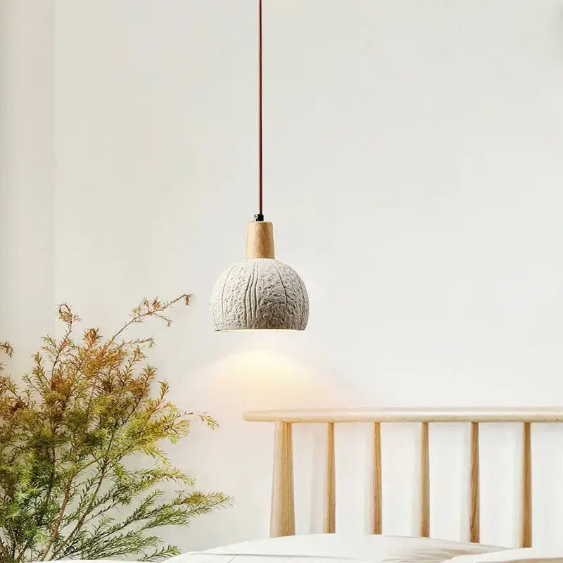 Minimalist pendant lamp with textured light gray cement shade and natural wood accent for dining room decorbites cement chandelier