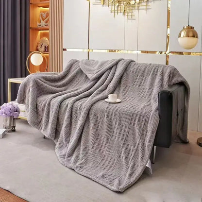 Textured gray coral fleece blanket knit throw with a plush cozy appearance perfect for bedroom use