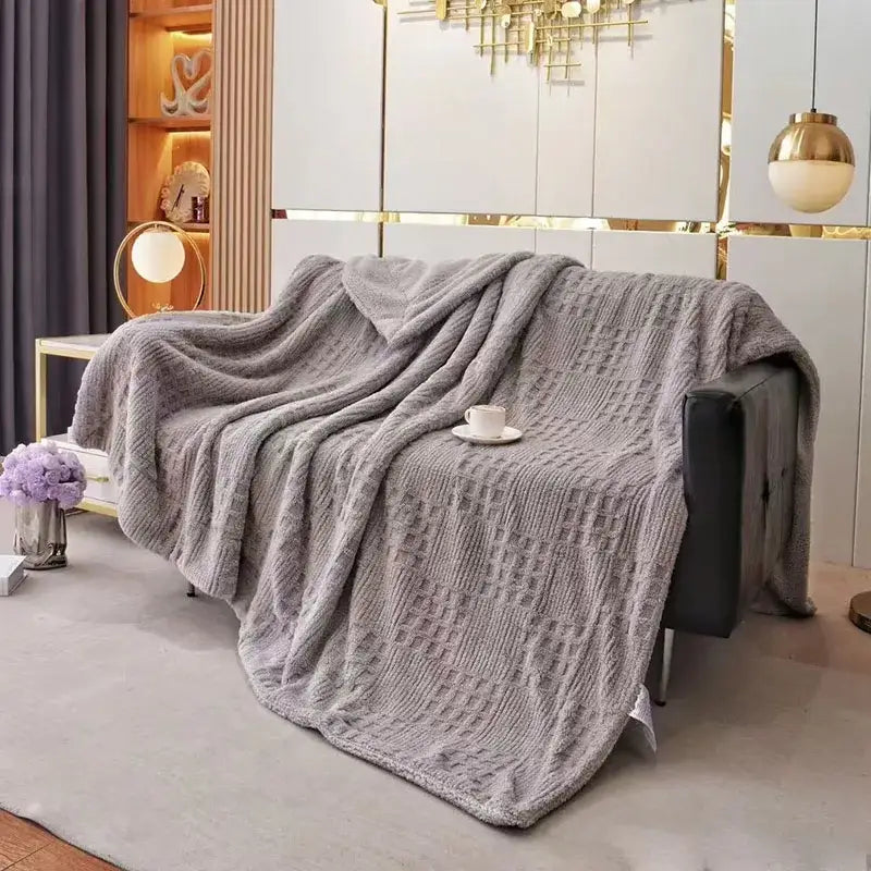 Textured gray coral fleece blanket knit throw with a plush cozy appearance perfect for bedroom use