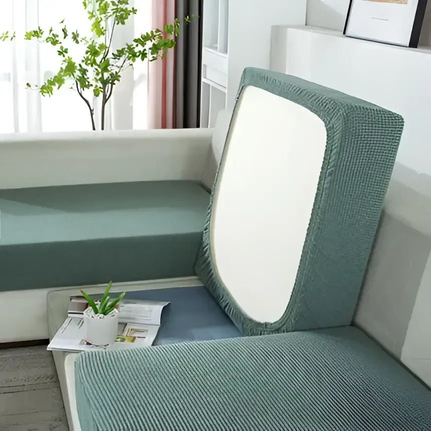 Teal textured fabric sofa cover with a white central panel elastic living room furniture protector