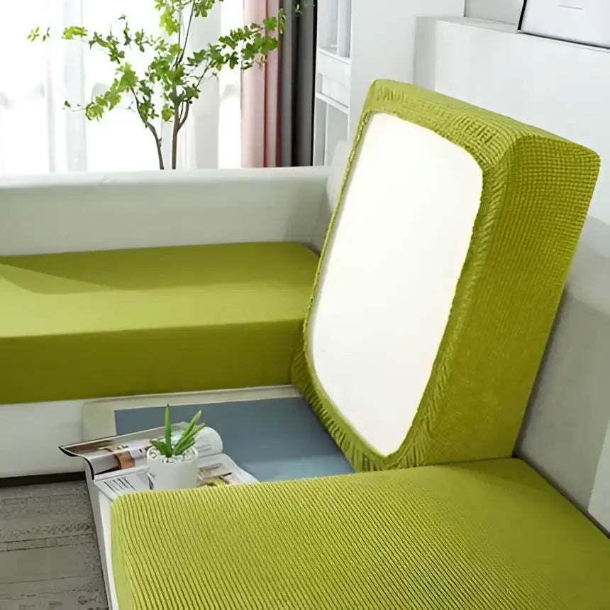 Textured lime green and beige elastic sofa cover with white central panel for living room furniture protection