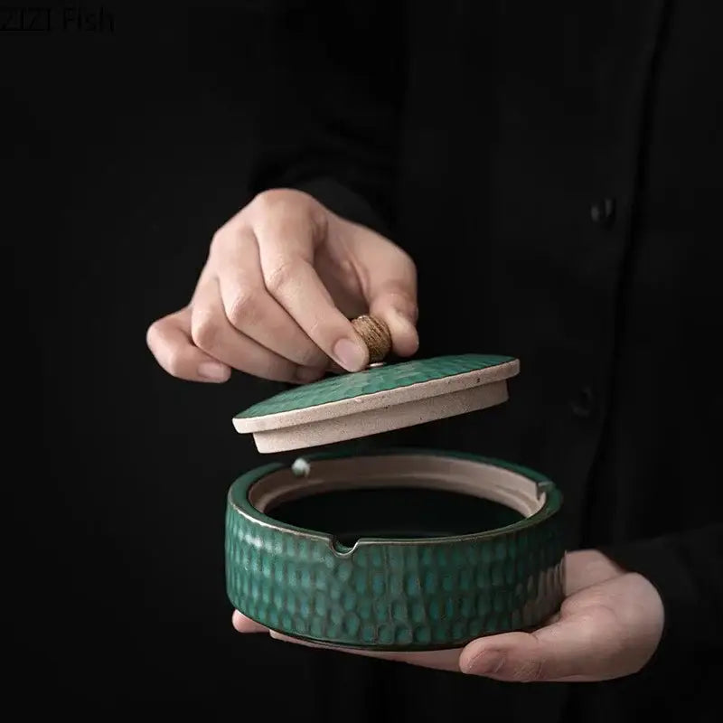 Textured green ceramic ashtray with hammer finish and lid with natural wood knob for living room smoking accessory