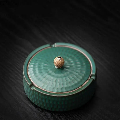 Teal green ceramic ashtray with hammered texture and wooden knob lid for living room smoking accessory
