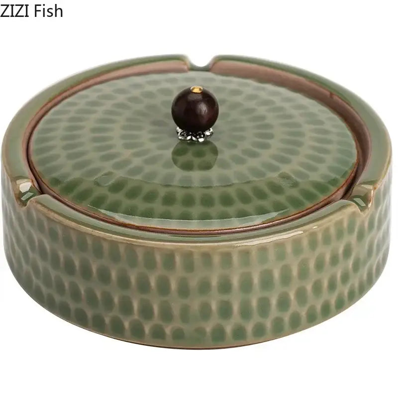 Textured green ceramic ashtray with hammered surface and dark brown wooden lid by decorbites for office or living room decor