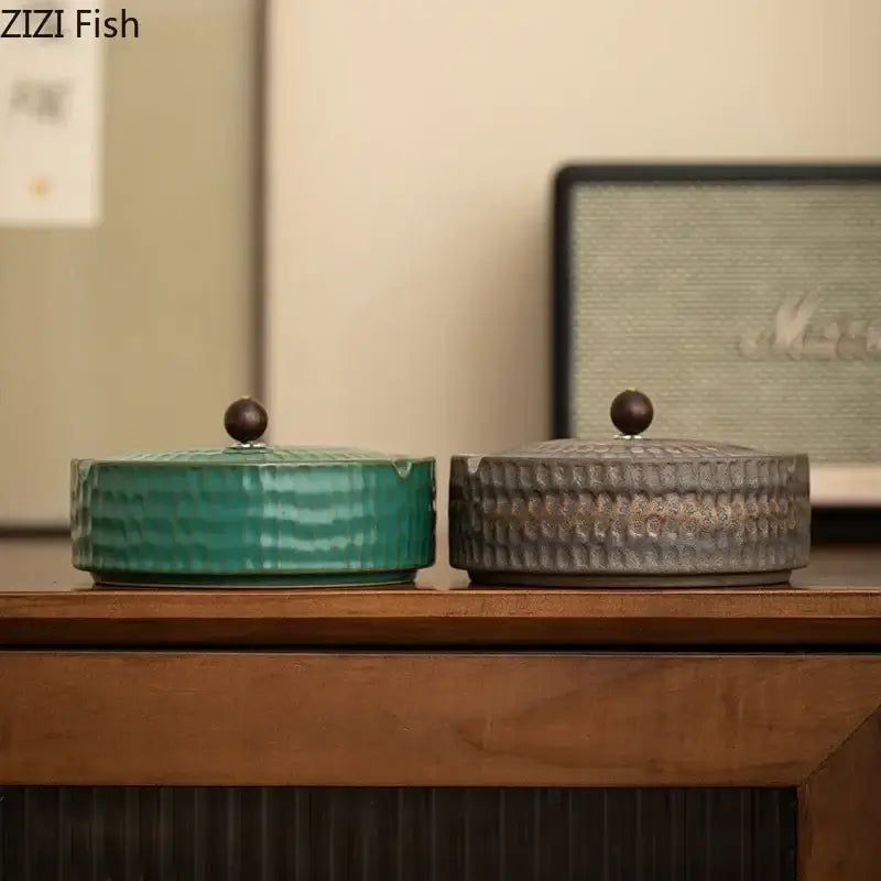 Two ceramic ashtrays in teal and gray with textured hammered finish and wooden lids by decorbites ceramic for office or living room