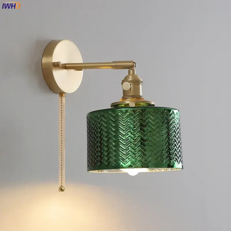 Textured green glass nordic wall sconce with chevron pattern mounted on a brass fixture for bedroom lighting