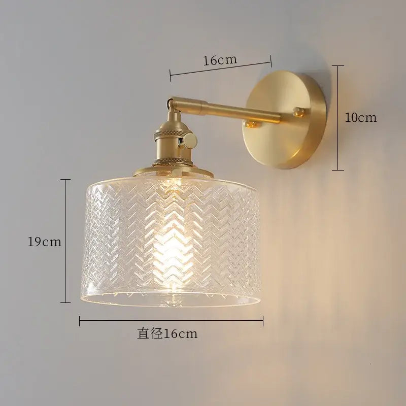 Gold-toned wall sconce with clear glass nordic shade featuring chevron pattern and green ceramic brass led light for bedroom