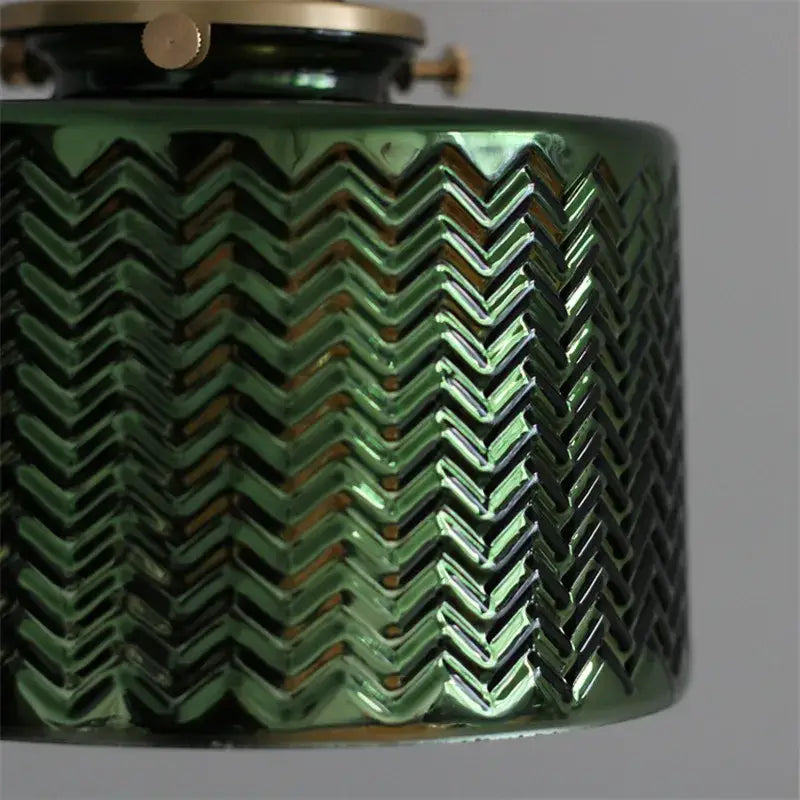 Textured green ceramic wall sconce with glossy zigzag pattern brass hardware ideal for bedroom green glass nordic lighting