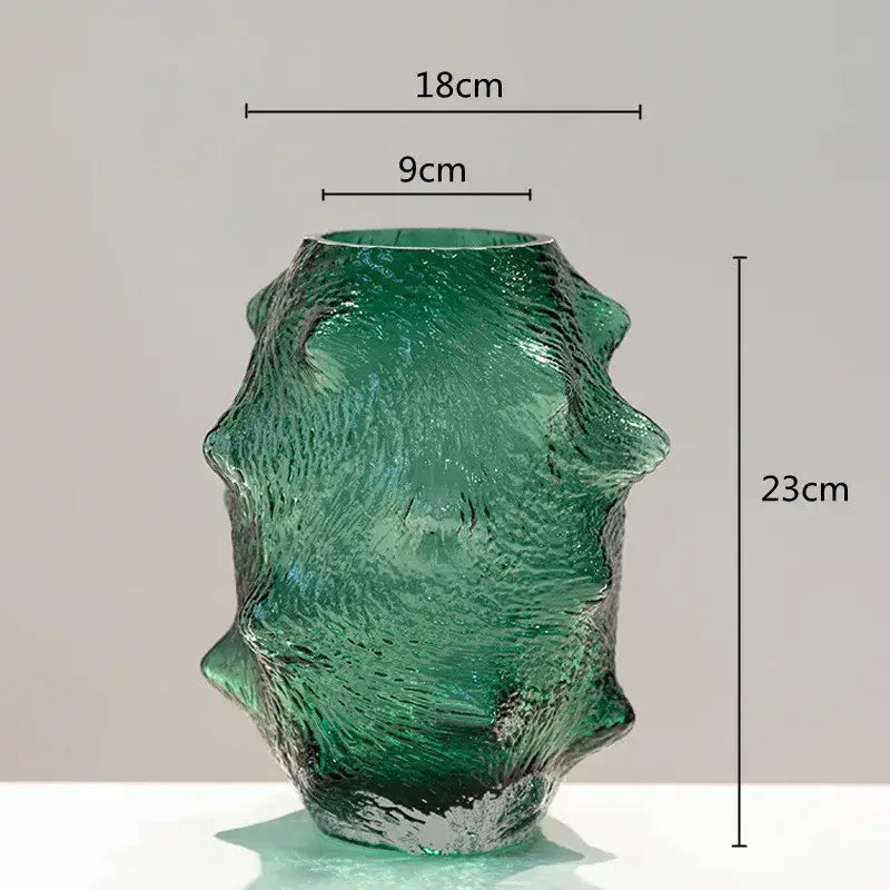 Textured green sea cucumber glass vase with sculpted organic form and irregular ridges for living room decor