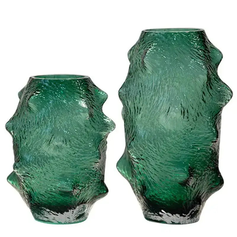 Two textured green sea cucumber glass vases with rough organic surfaces and darkened bases for living room decor