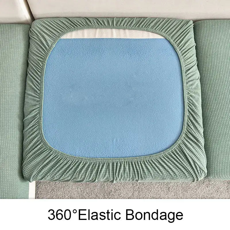 Light green elastic textured waterproof sofa cover with soft blue inner pad for living room use