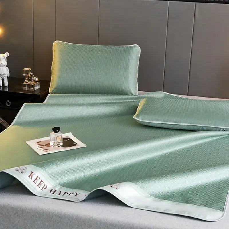 Mint green textured cooling bed mat with keep happy embroidered border from 1800d cooling fibres pillowcases set