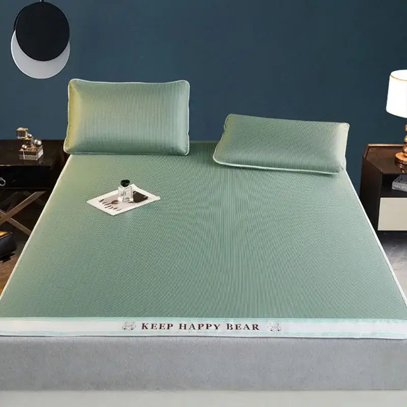 Light green textured cooling bed mat with keep happy bear branding made of 1800d cooling fibres pillowcases set