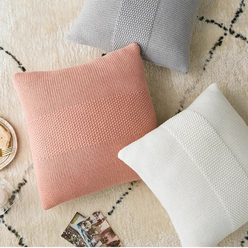 Soft pink knit cushion cover with a textured ribbed pattern suitable as a decorbites knit cushion for living room decor