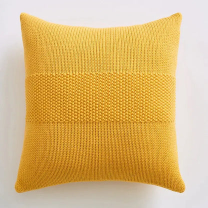 A mustard-yellow knitted throw pillow with textured knit cushion cover featuring dense horizontal bands for living room decorbites