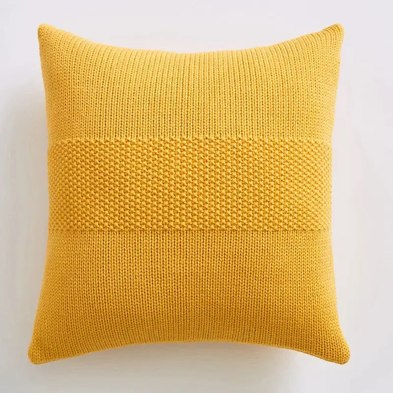 A mustard-yellow knitted throw pillow with textured knit cushion cover featuring dense horizontal bands for living room decorbites