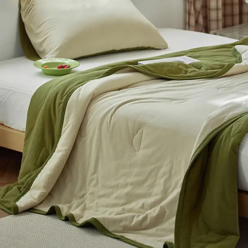 A cozy olive green and cream decorbites cotton summer comforter with quilted texture for bedroom cooling